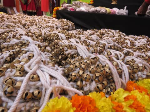 Ankle bells and flowers laid out for Vijayadashami